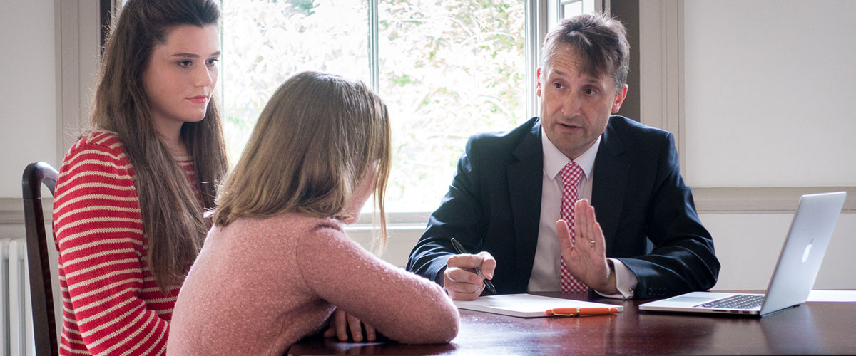 Dr David Campbell consulting with patients